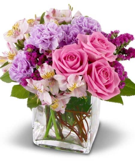 A glamorous bouquet of fresh flowers in delectable shades of raspberry, lavender and pink. Roses, Alstroemeria lilies and more are sure to delight any lucky recipient.