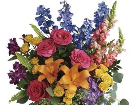 This lovely tall arrangement created in a glass vase is designed with all the favorite flowers from the local flower market. The bright and vibrant colors is the perfect combination to make anyones day brighter. 