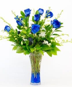 This gorgeous bouquet is created with long stemmed blue Roses and accenting white Orchids.