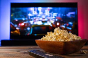 Movie screen and wooden popcorn bowl